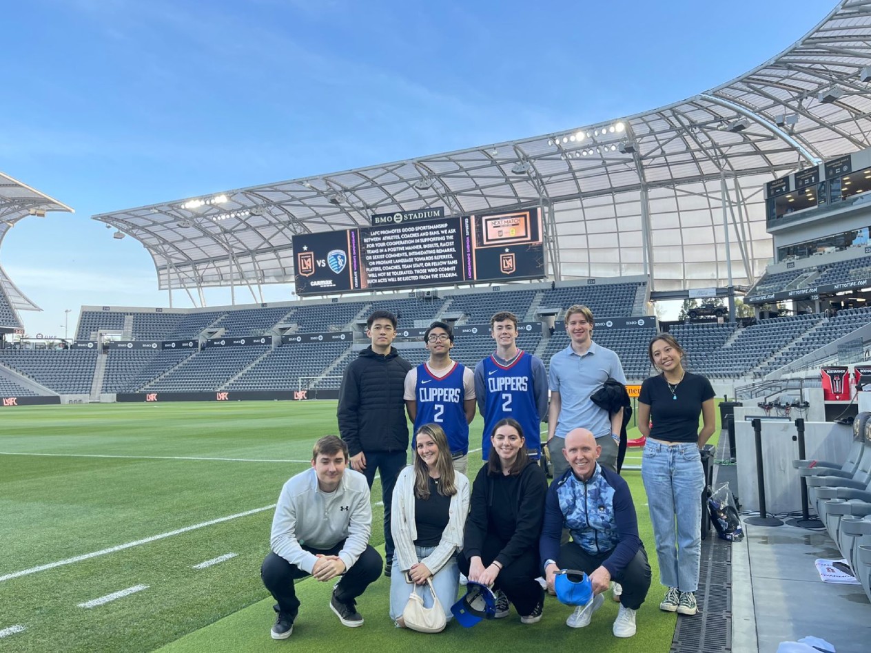 Rishe leads students on whirlwind tour of west regional sports venues, organizations