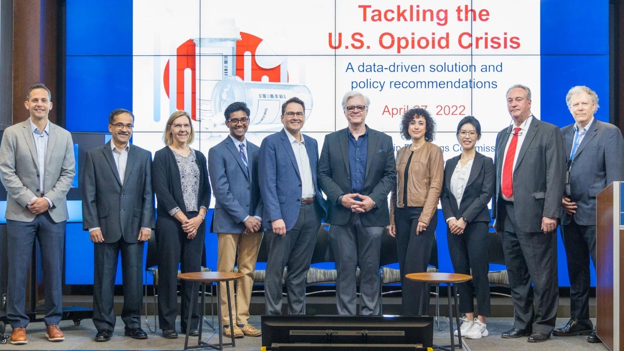 Members of the opioid crisis commissions pose for a group shot at the findings launch event