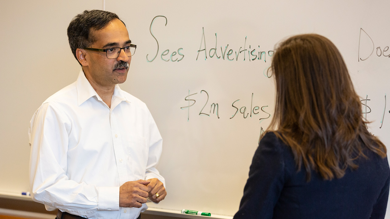 Prof. Seetharaman consulting with a fellow researcher.