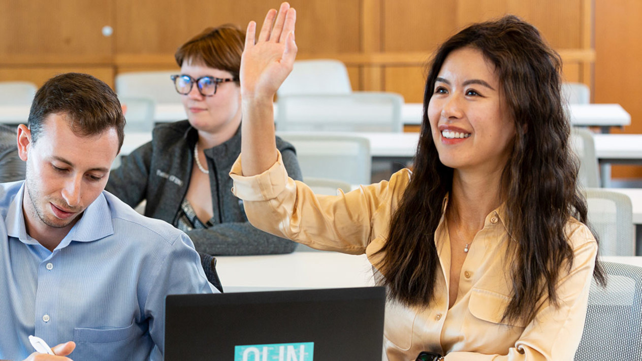 Doctoral Students attending a lecture at Olin Business School.