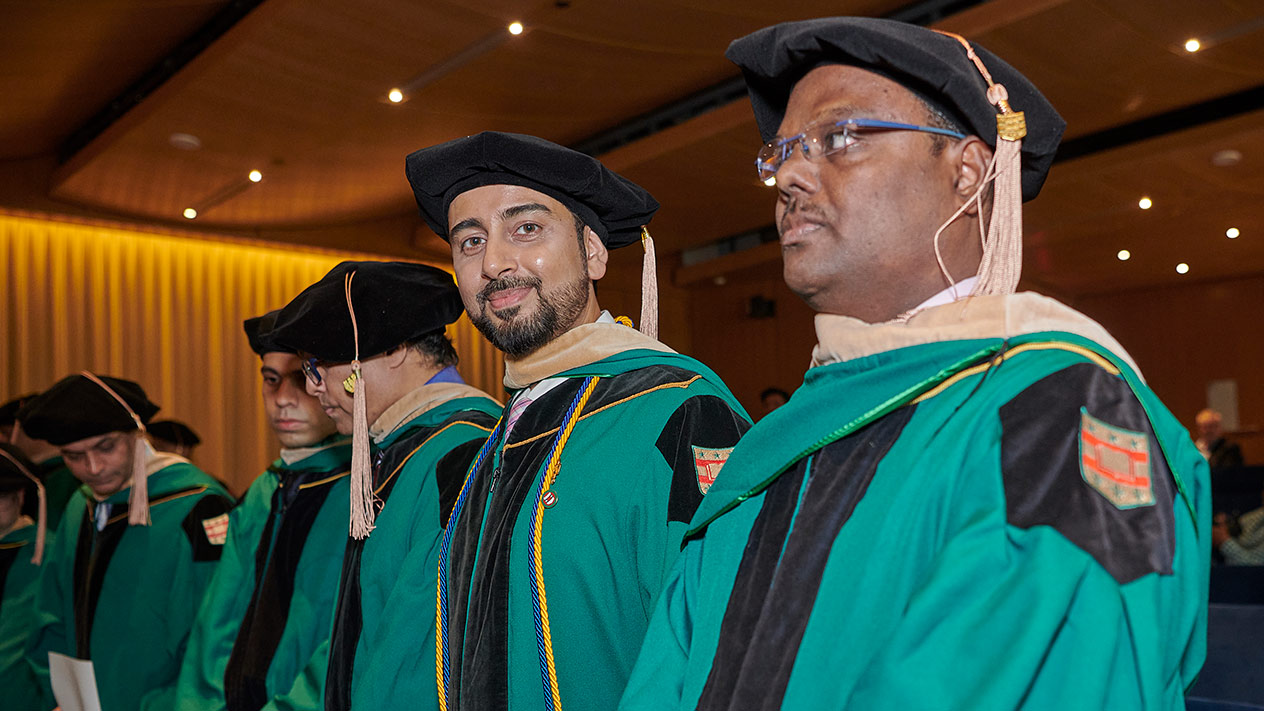 Students graduating from the EMBA program in Mumbai through the Olin School of Business