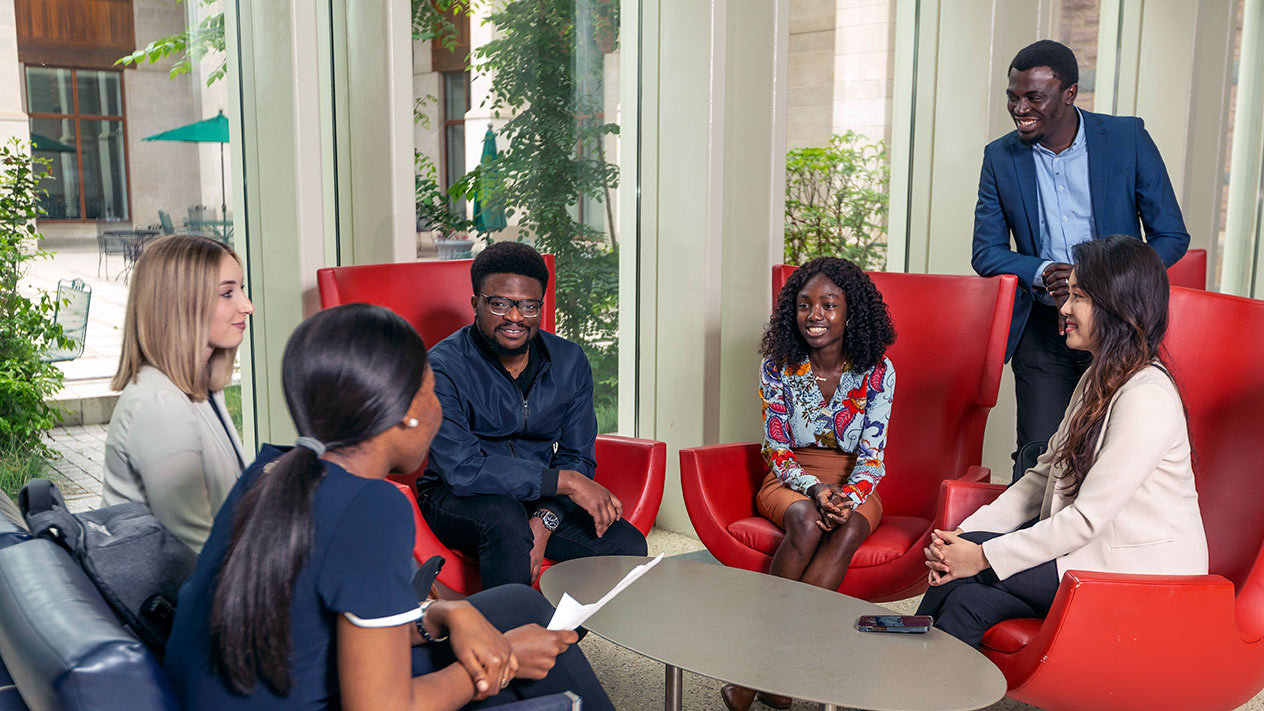 MBA students relaxing in the atrium.