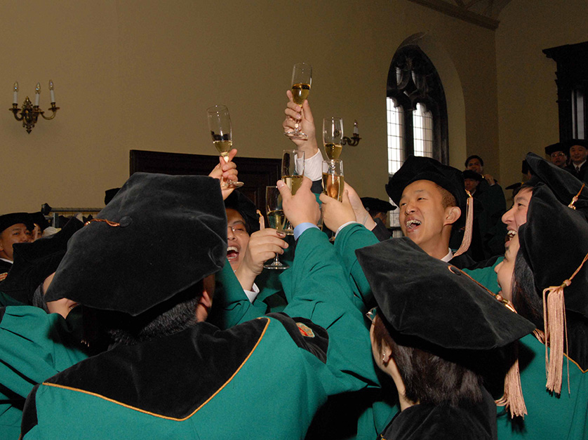 Students toasting each other on graduation day