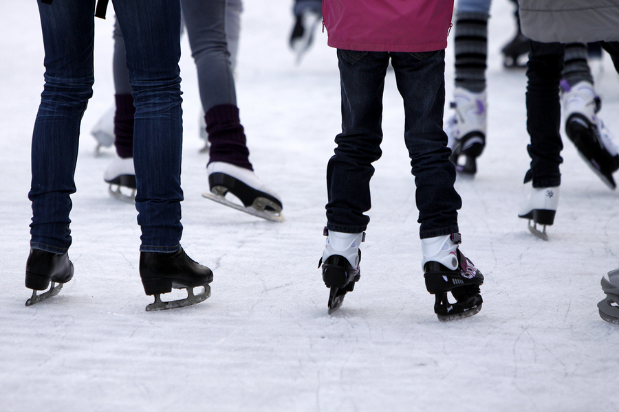 Several people skating on ice