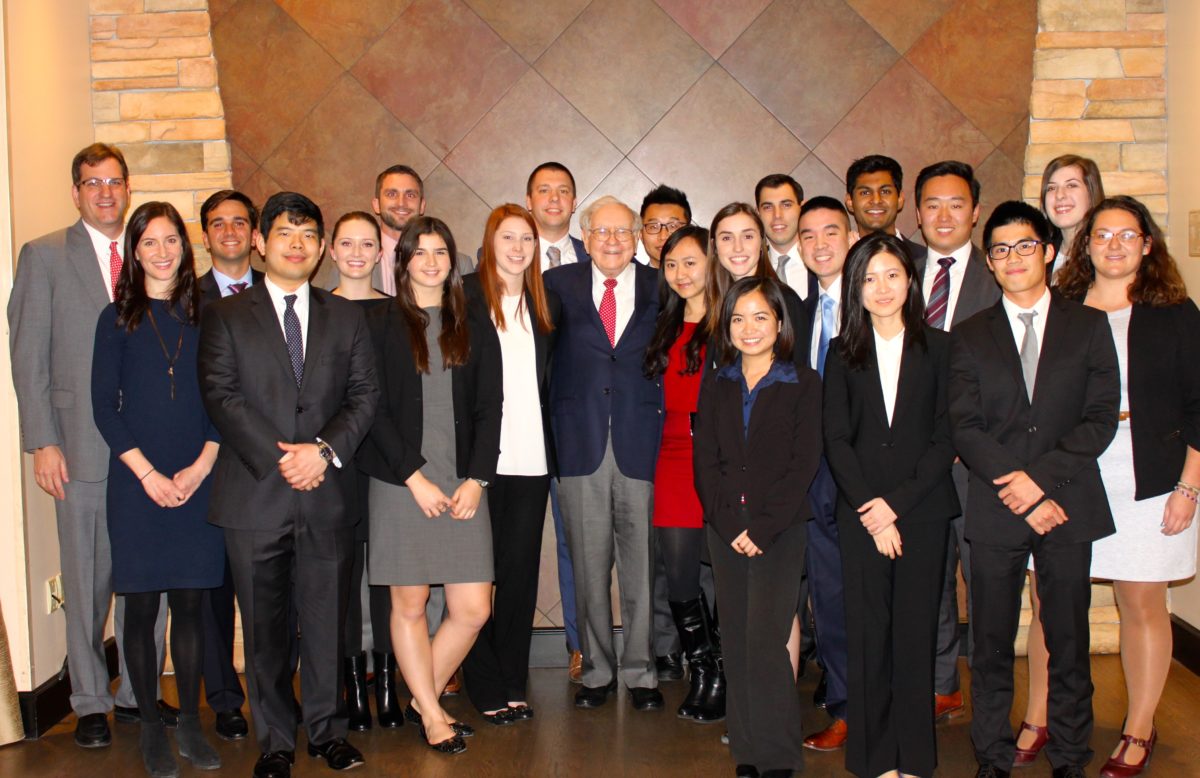 Students gather with Warren Buffet at Berkshire Hathaway headquarters in Omaha, Nebraska.