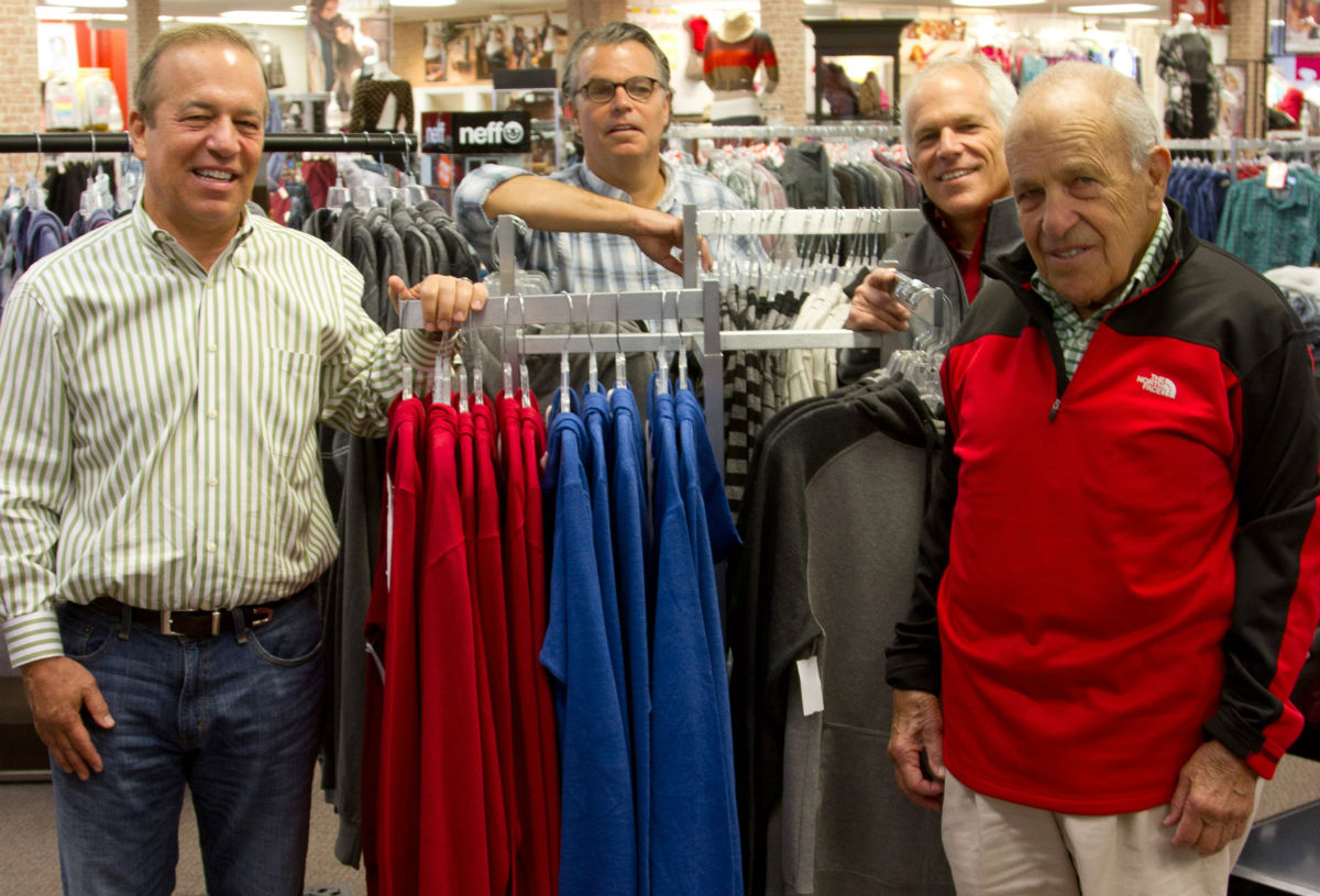 Joe Glik, right, with sons Robert, Jeffrey, and James, at a Glik’s store in Farmington, Mo., Photo courtesy of the Farmington Chamber of Commerce.
