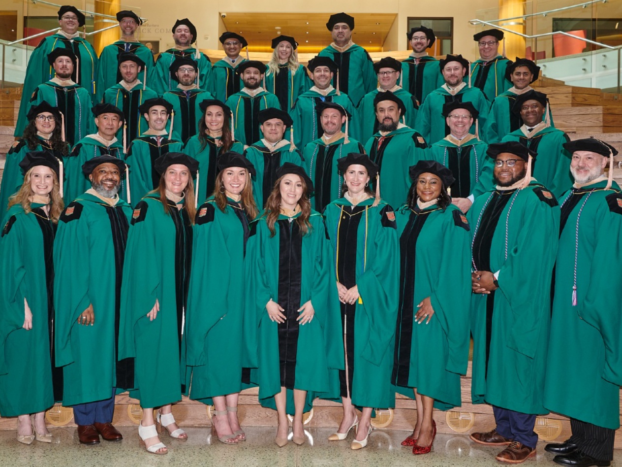 A group of Executive MBA students at their graduation.
