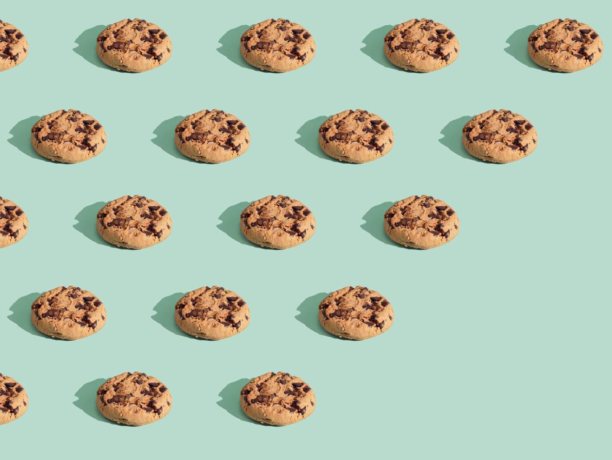 rows of cookies on a green background