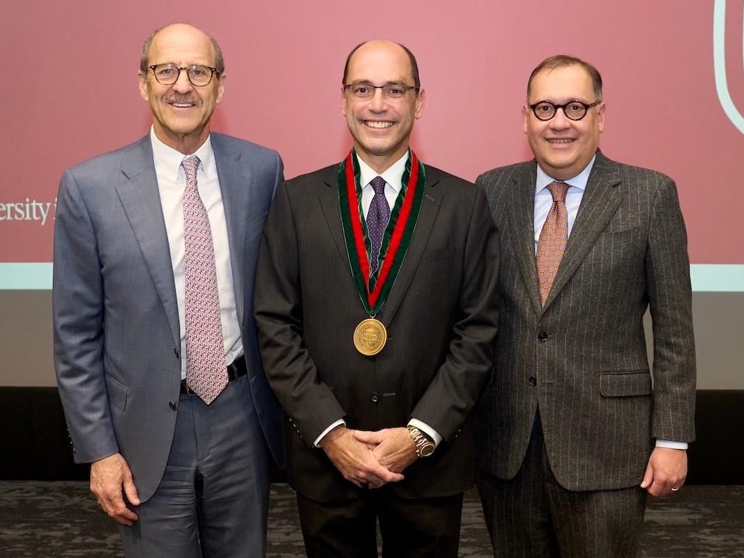 Goldfarb, center, with David Perlmutter, left, the med school's dean, and Chancellor Andrew Martin.