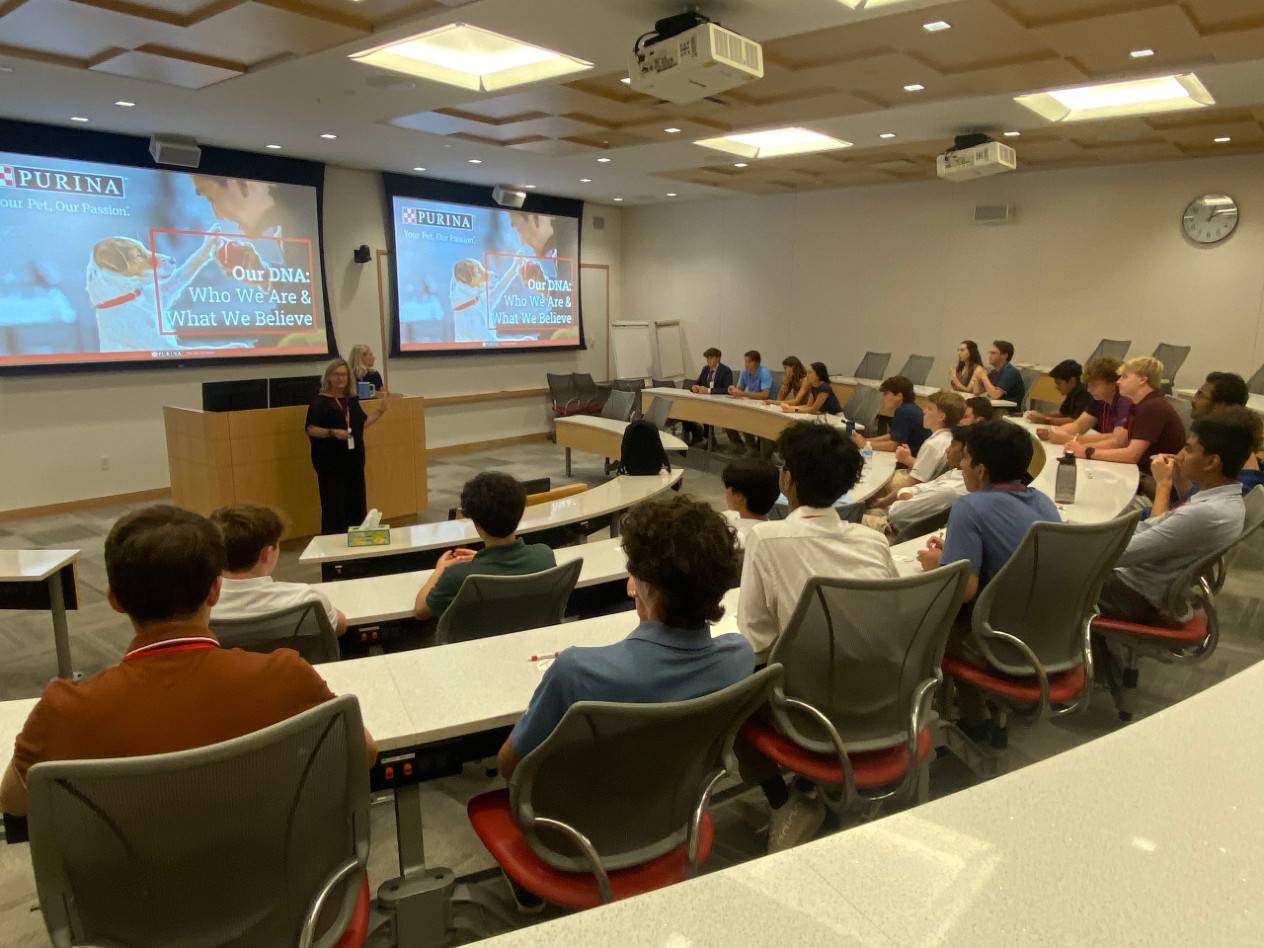 A group of students listens to a presentatio