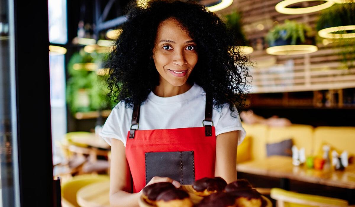 Black businesswoman with pastries