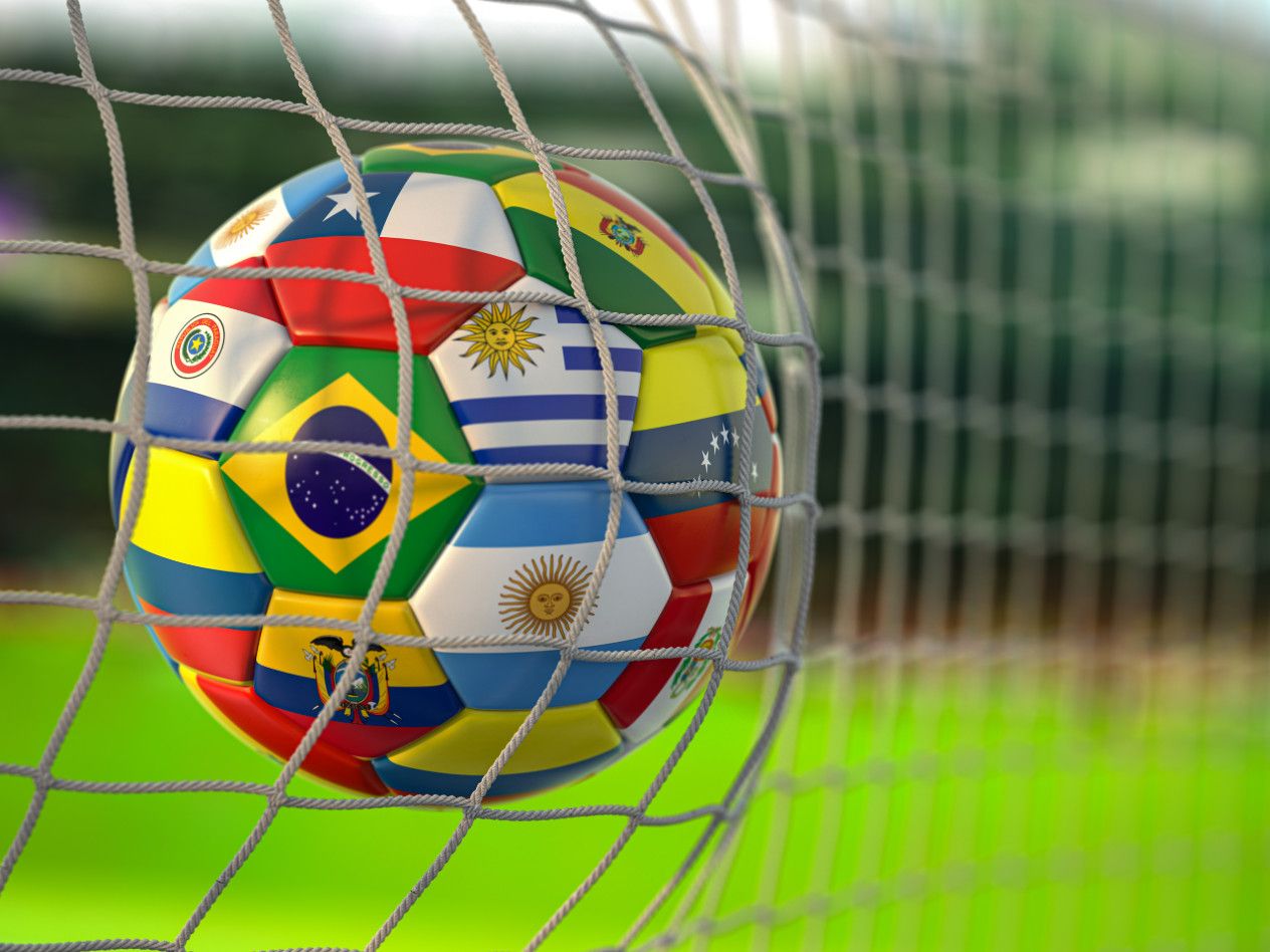 Soccer ball with international flag design in soccer net