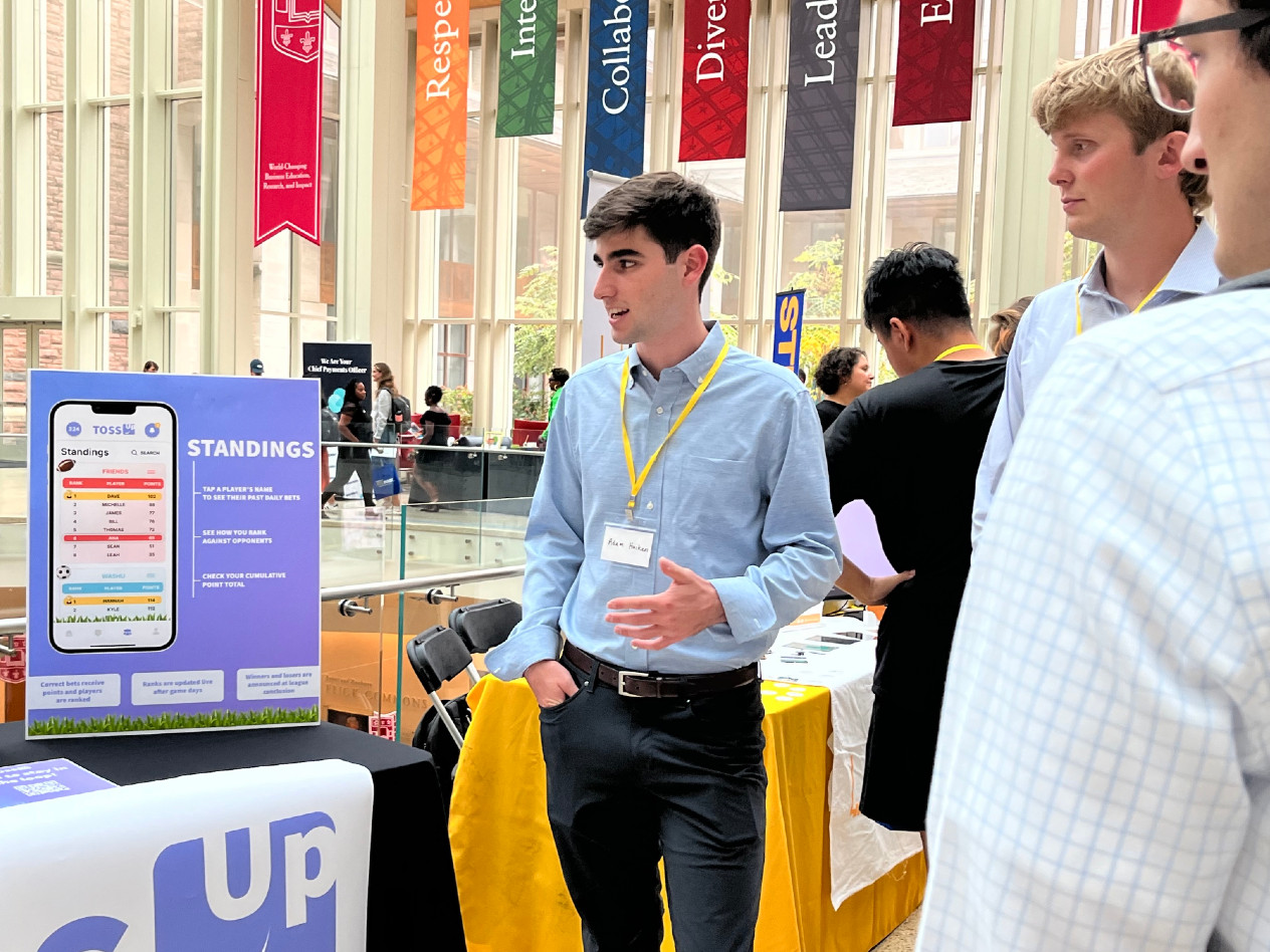 Student startup owners show their product to attendees at the St. Louis Startup Connection
