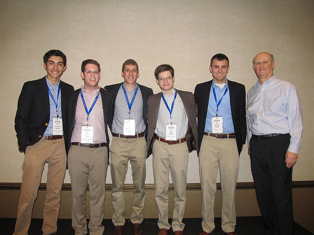 The WashU Sports Analytics Club team included: Tyler Brandt, Brent Katlan, Kenneth Dorian, Brody Roush, and Ben Rosenkranz, pictured with Vince Gennaro, developer of the case and author of Diamond Dollars: The Economics of Winning in Baseball, and consultant to MLB teams.