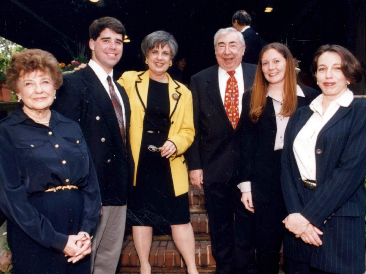 Sidney Guller, center, at the Guller scholarship dinner in 1998 with students.