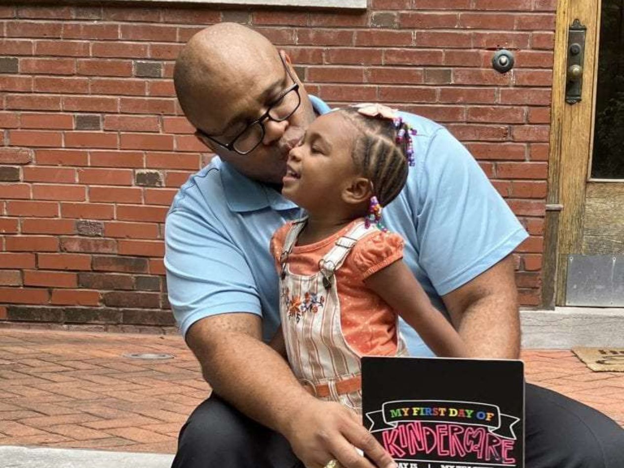 Marcus Jackson holding his daughter, Asha