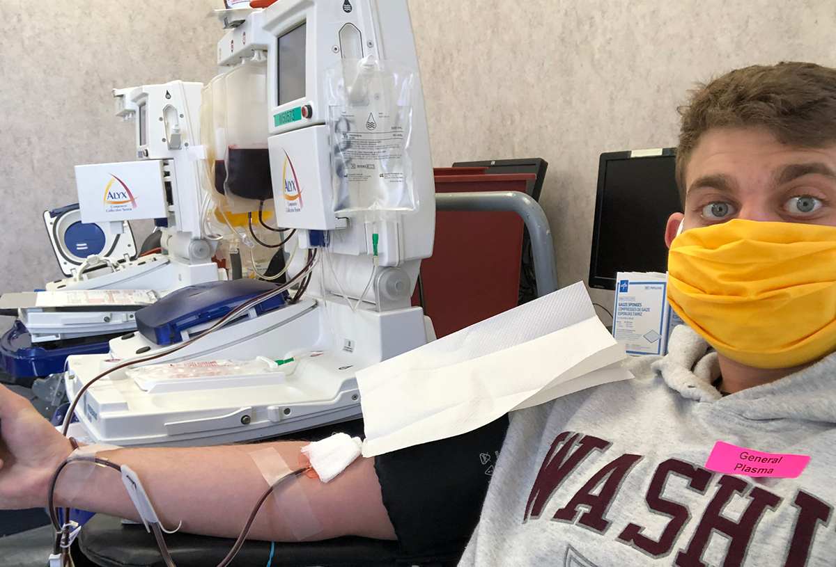 Loebel in the chair donating his plasma for the first time