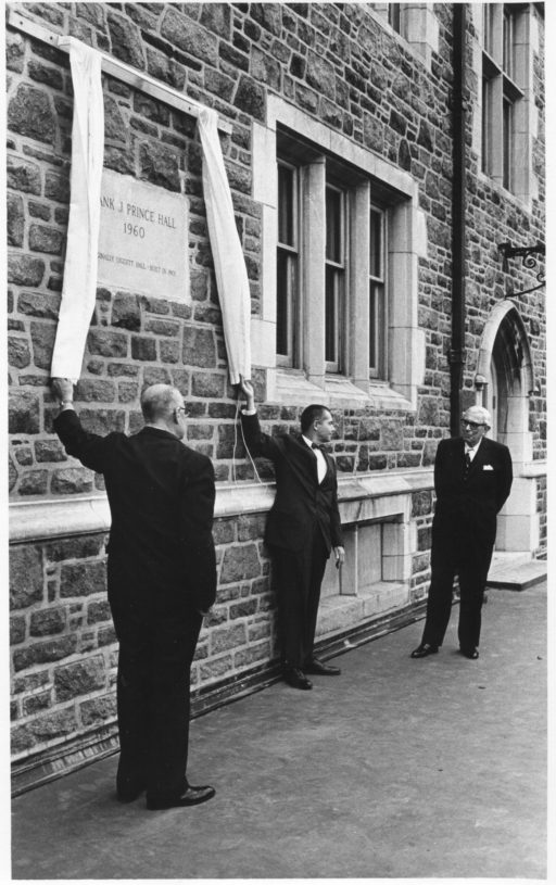 Frank J. Prince, on right, looks on as the building formerly known as Liggett Hall is dedicated as Prince Hall.